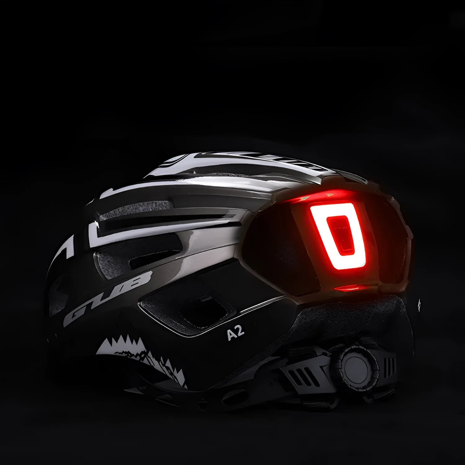 Bright titanium cycling helmet with integrated USB rechargeable taillight and 19 ventilation holes on side view