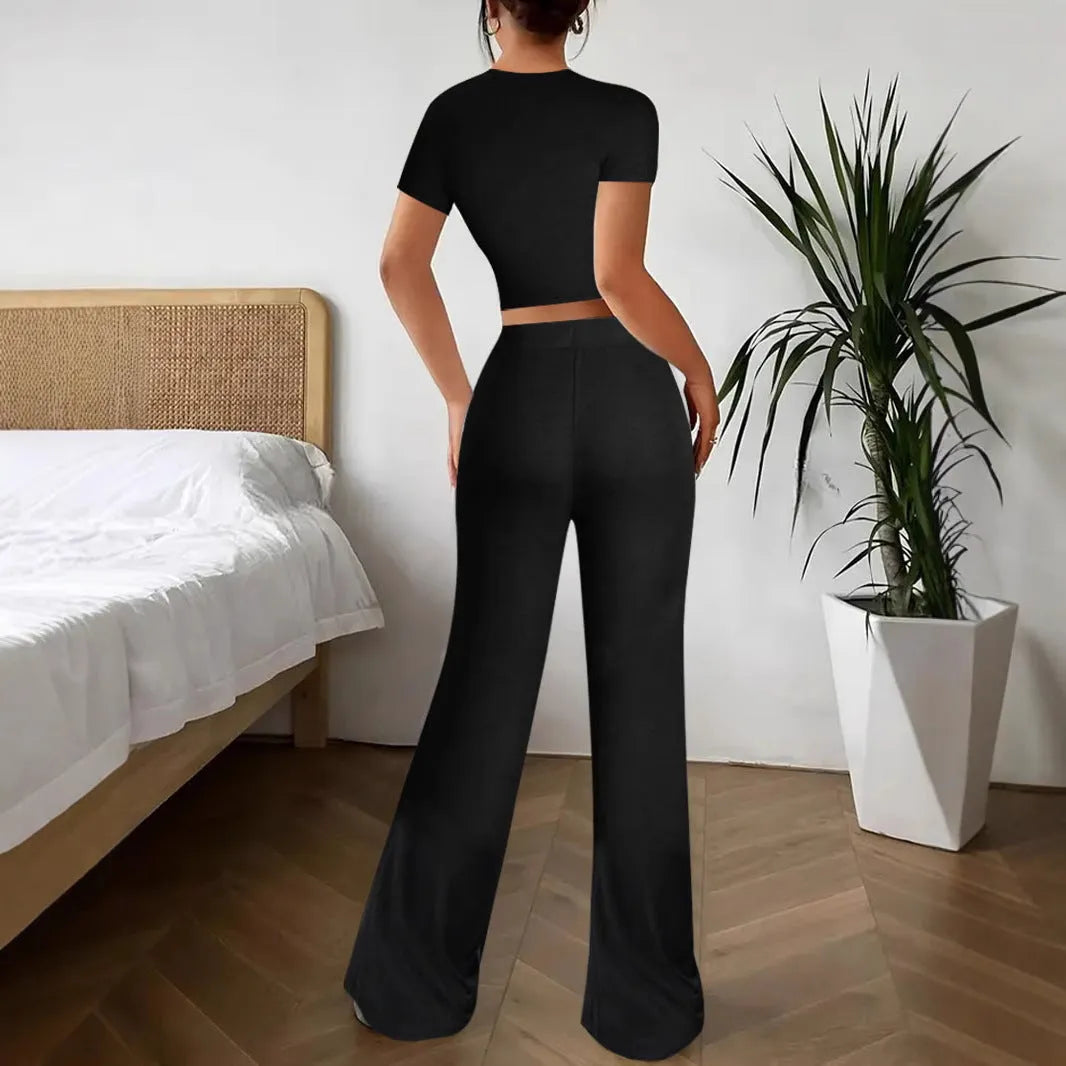 Black high waist trousers and short sleeve t-shirt women's co-ord set on a hanger