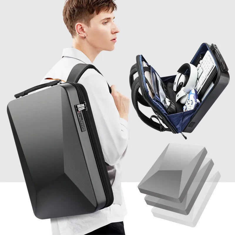 Large black or silver hard shell PC gaming backpack with lock, showing internal organisation pockets.