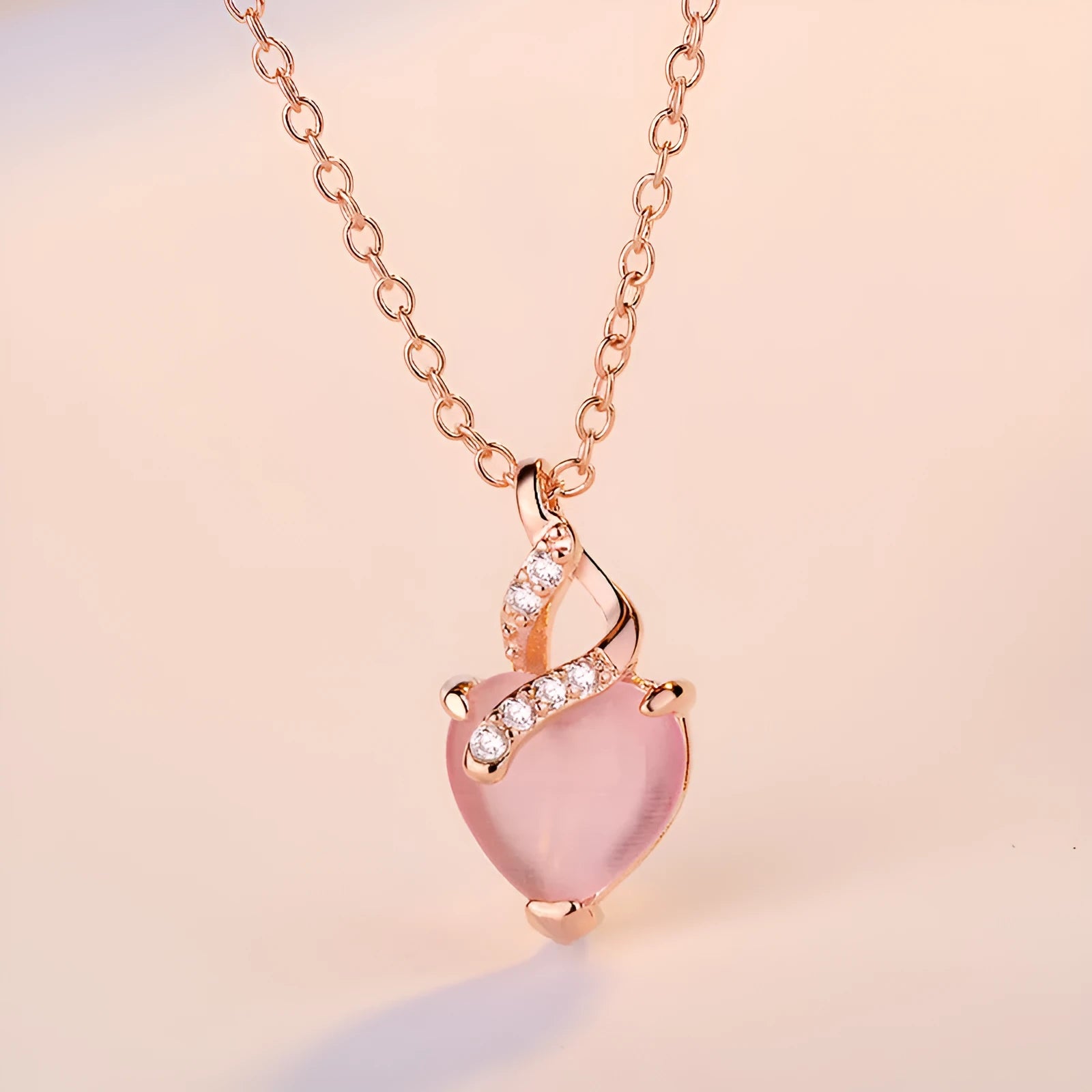 Rose gold heart necklace with pink artificial crystal pendant on cross chain