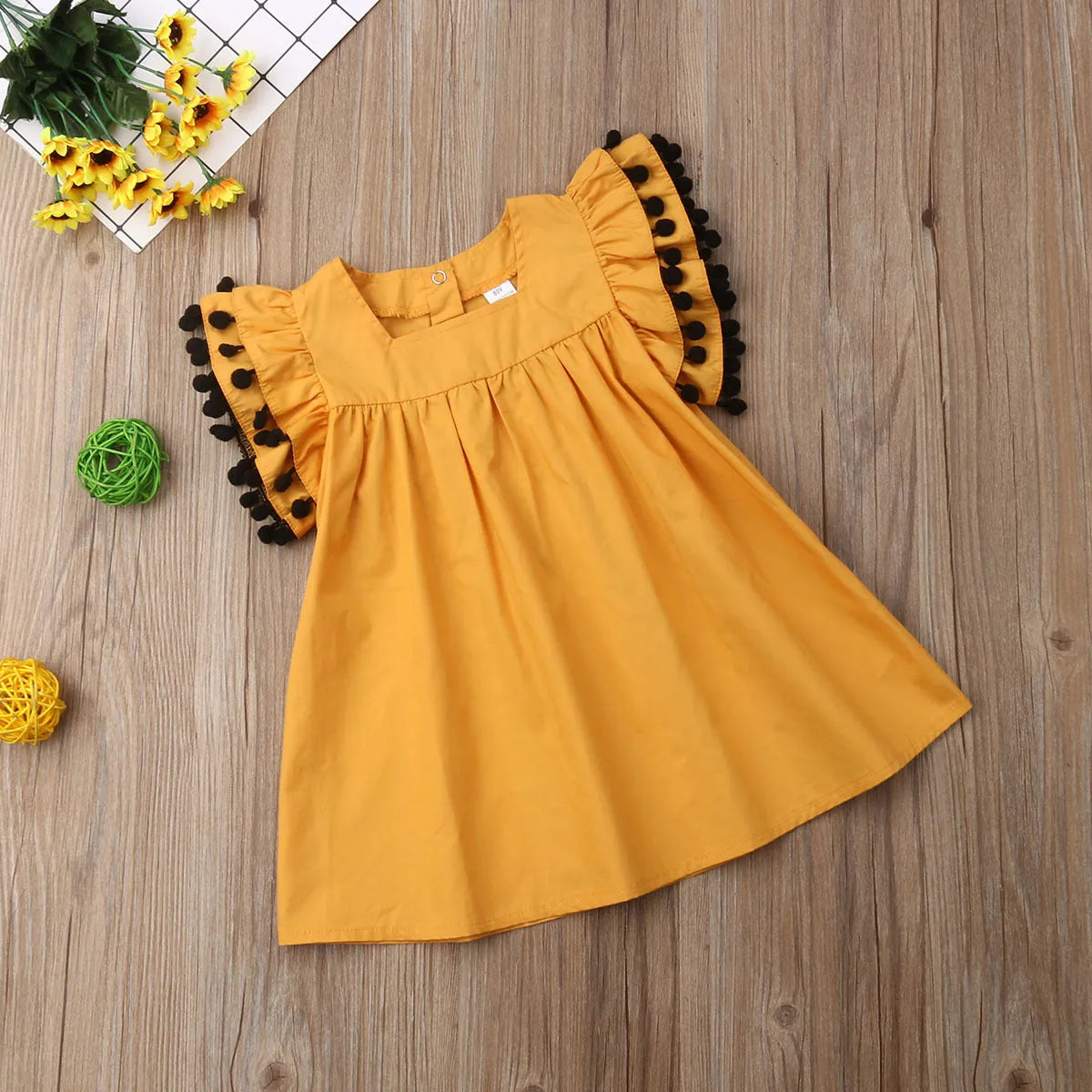Sleeveless orange girls dress for children ages 3 months to 14 years, sizes 12M to 5T
