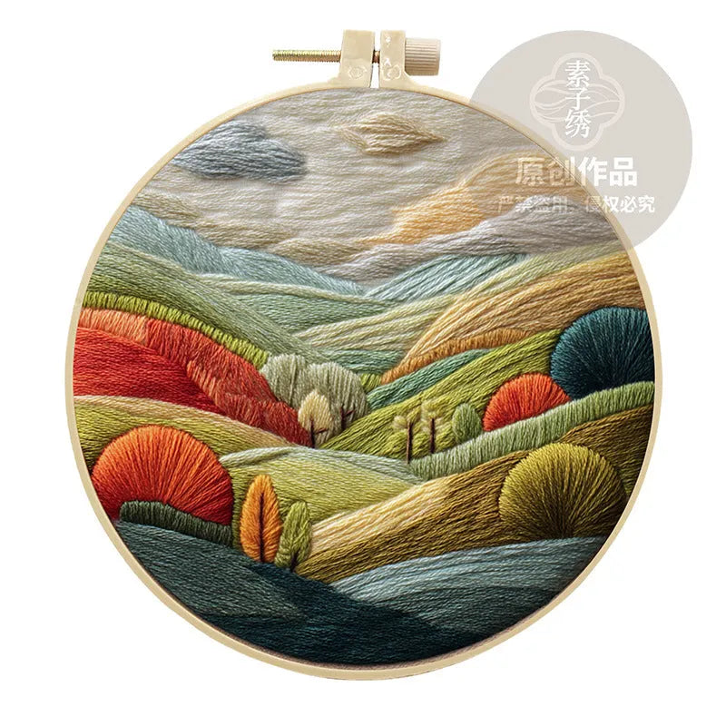 Embroidery DIY kit with landscape printed fabric, bamboo frame, thread, and needles for handmade cloth art