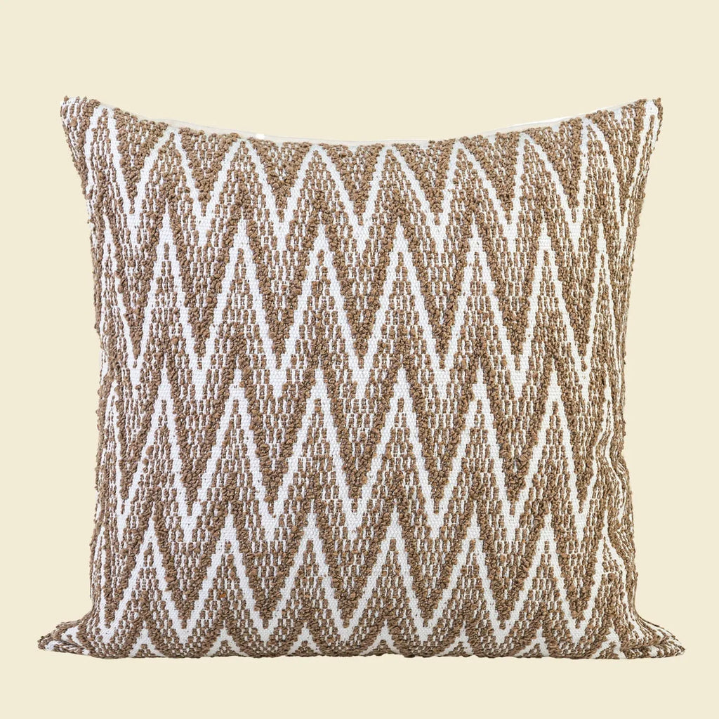 Square Chinese ancient style cushion in brown Maillard colour on a sofa.