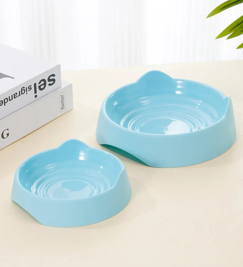 Ceramic dog slow feeder bowl with raised maze pattern in blue, green, or pink colours