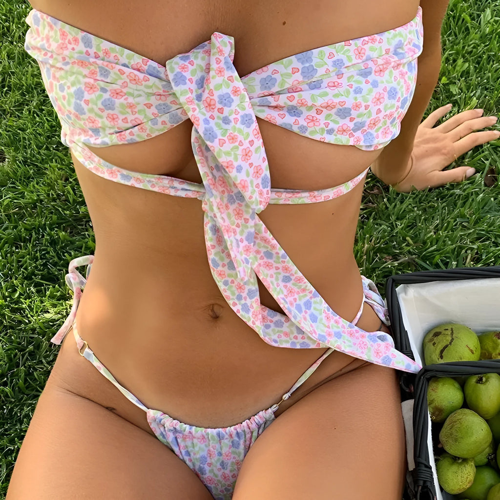 Women's lace-up front swimsuit with chest pads and split leg design in floral print