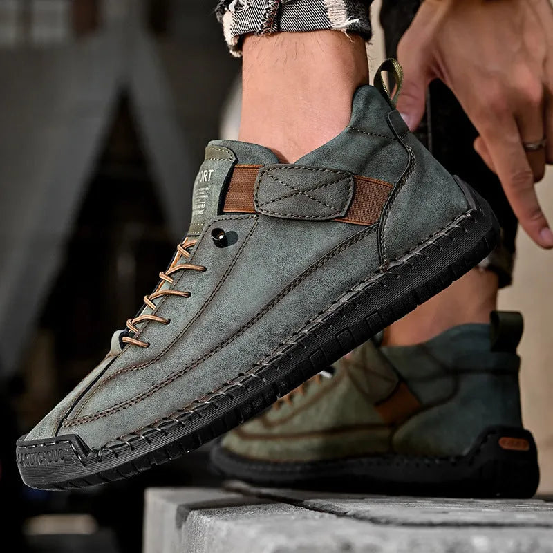 Men's mid-top Martin boot in khaki with visible stitching, on a flat rubber sole.