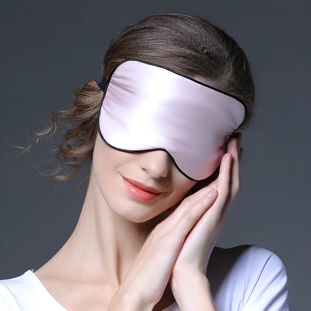 Double-sided mulberry silk eye mask showing embroidered print, in 22cm by 11cm size.