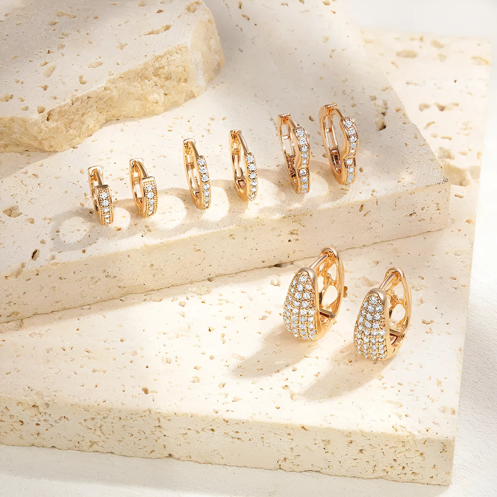 Brass gold plated heart-shaped clip earrings with simple zircon accents and gang drill elements