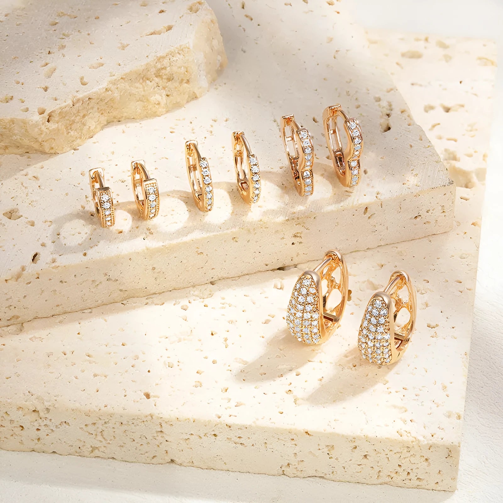Brass gold plated heart-shaped clip earrings with simple zircon accents and gang drill elements
