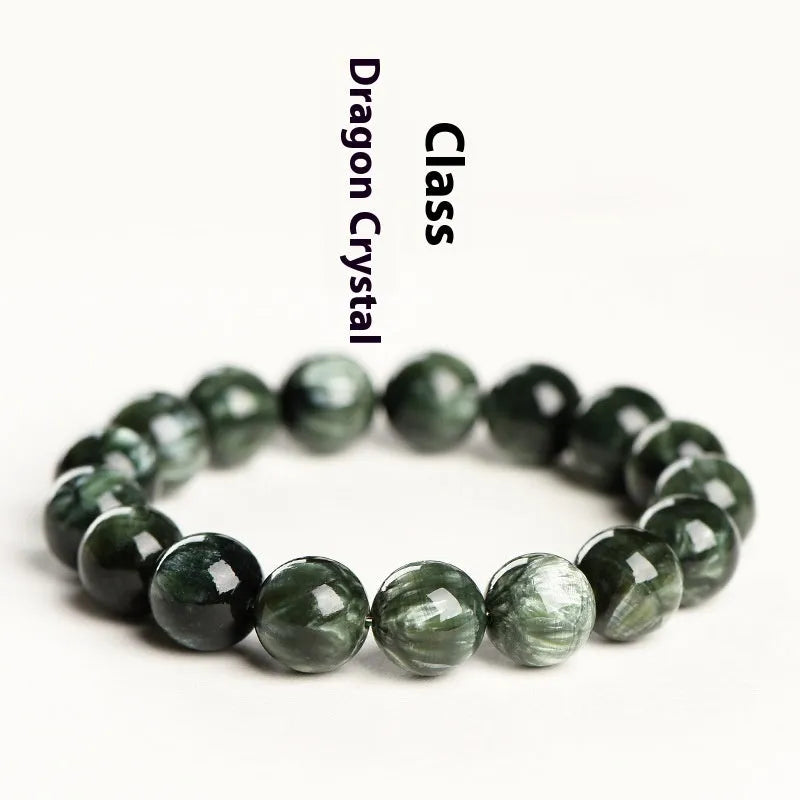 Green Dragon Crystal bracelet with Ruyi design and 8-9mm round beads on a wrist.