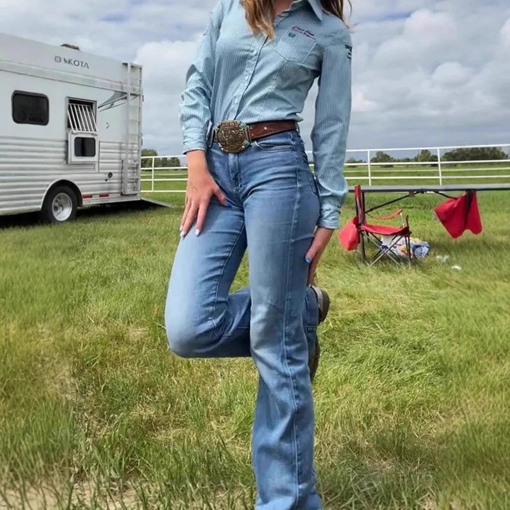Slim fit mid-waist jeans with slight flare and embroidery details on blue denim