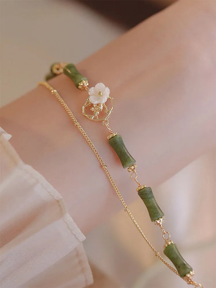 Natural green olivine bracelet with double layer design featuring olive branches and bells of Ireland motifs