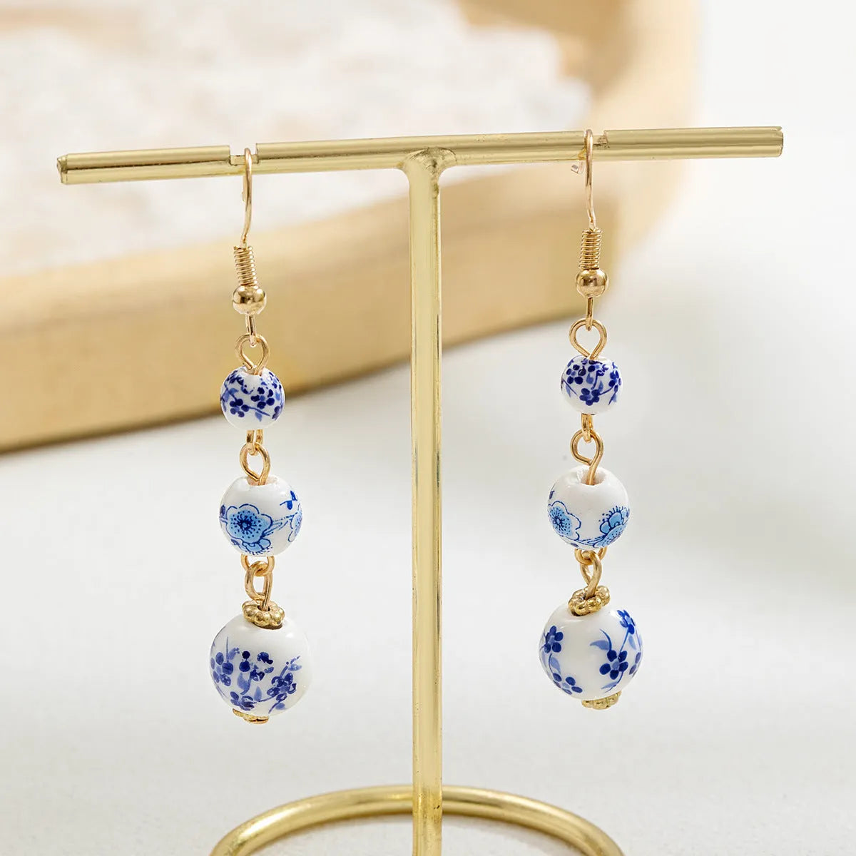 Blue and white porcelain ceramic bead retro earrings with geometric alloy components
