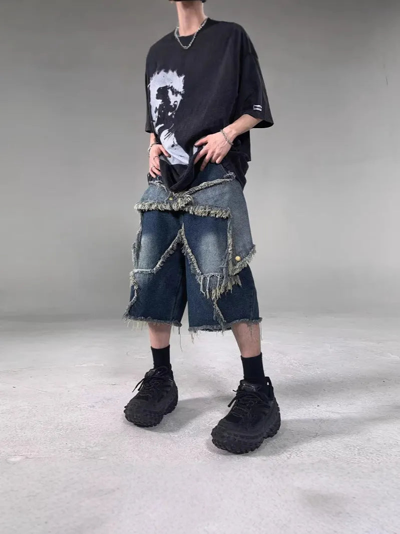 Blue men's loose-fit denim shorts with a frayed five-pointed star detail on the leg, showing American retro style.