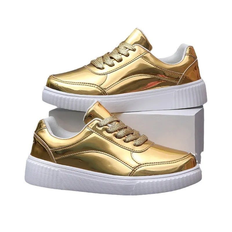 Gold sequinned unisex platform sneaker with thick sole and stitching detail on a white background.